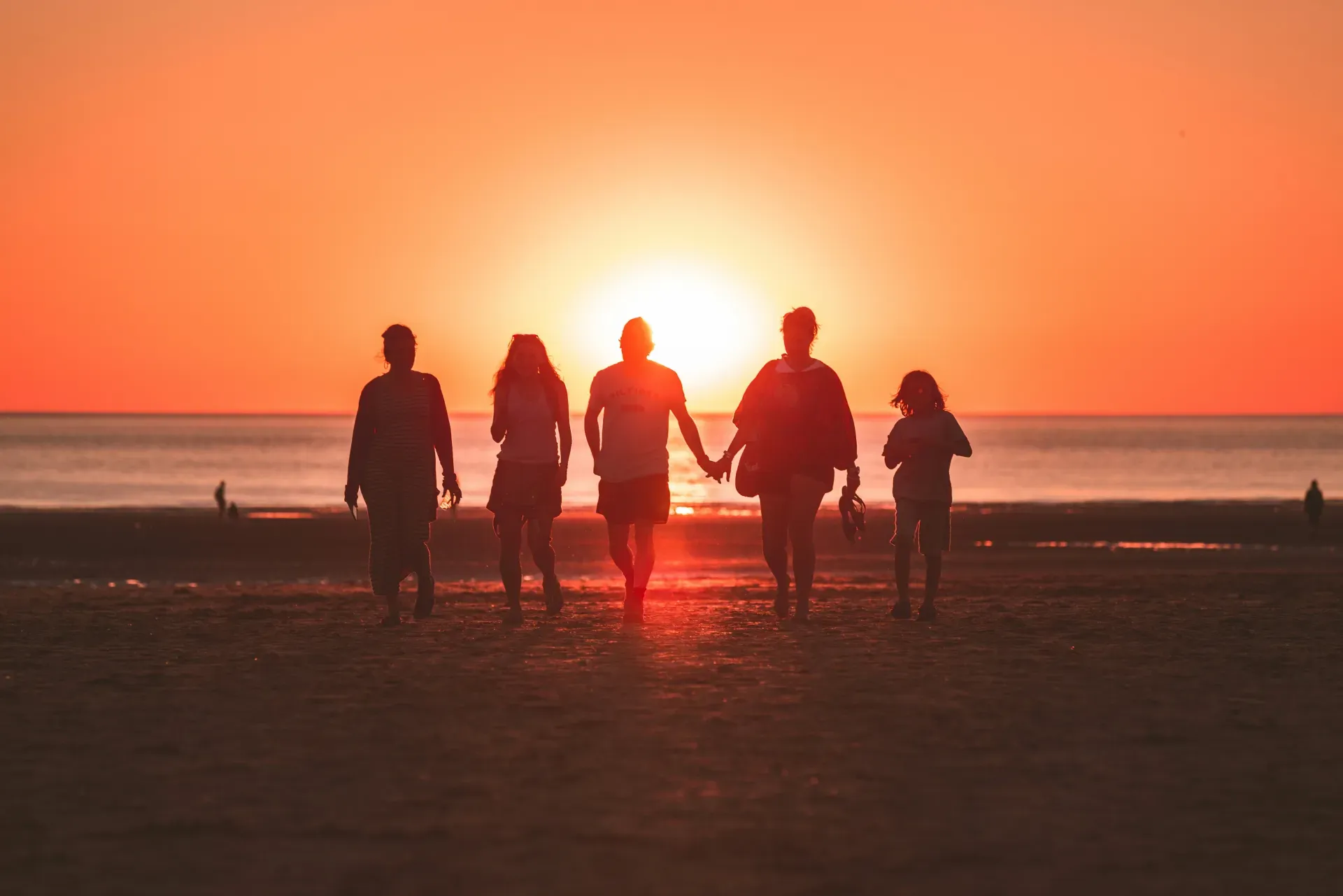 Family walking together at golden hour